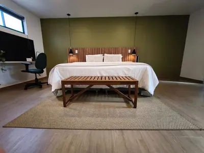 a bedroom with a bed with a table and a desk at Florentina Living 301 V in Medellín