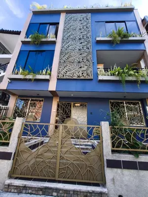 a blue building with a design on it at Florentina Living 301 V in Medellín