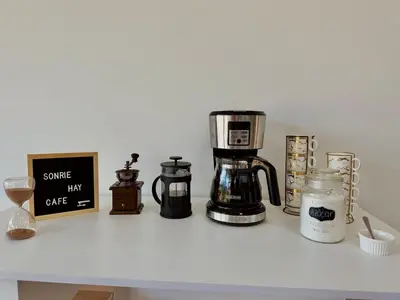 a counter with a coffee maker and other items on it at Casa Fénix in Marinilla