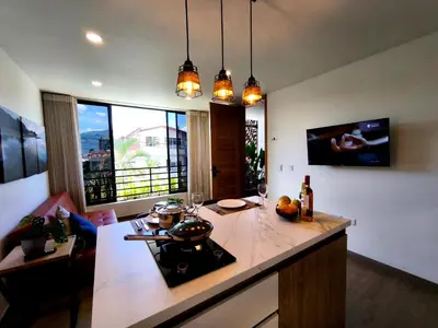 a kitchen with a counter and a stove top oven at Florentina Living 302 A in Medellín