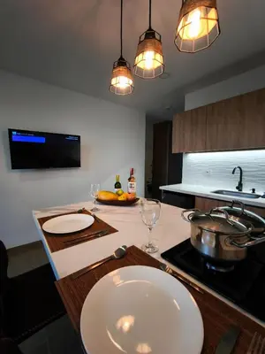 a kitchen with a counter with glasses and a sink at Florentina Living 302 A in Medellín