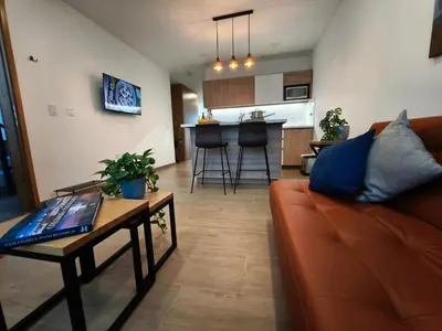 a living room with a couch and a table at Florentina Living 302 A in Medellín