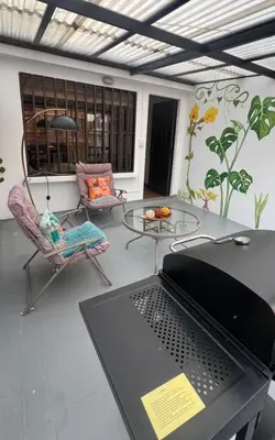 a laptop computer on a table in a room at Lindos Apartamentos con Terraza in Manizales
