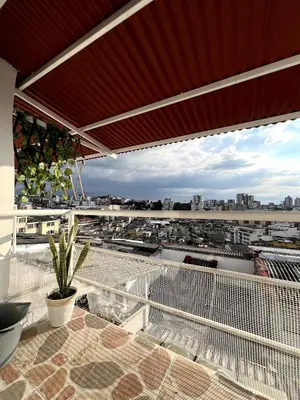 a balcony with a view of a city at Lindos Apartamentos con Terraza in Manizales