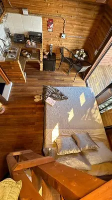 an overhead view of a bed and a table in a room at Casa Tikkun in Medellín