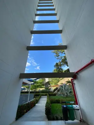 a stairway leading up to a building with a blue sky at Luxury Apartment Citadela de Sole Santa fe de Antioquia in Santa Fe de Antioquia