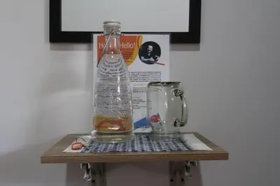 a bottle of water sitting on a shelf next to a blender at Living Poblado Manila 301 D Habitación Doble in Medellín