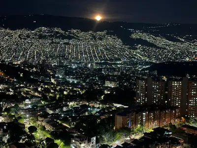 a view of a city at night at Apartamento Medellin con Jacuzzi privado in Medellín