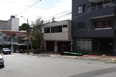 an empty street in a city with a building at Living Poblado Manila 301 B Habitación Individual in Medellín