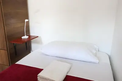 a white bed with two towels on it in a room at Living Poblado Manila 301 B Habitación Individual in Medellín