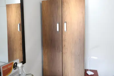 a pair of wooden cabinets in a room at Living Poblado Manila 301 B Habitación Individual in Medellín