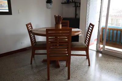 a dining room table with four chairs and a table and a table and chairsktop at Living Poblado Manila 301 C Habitación Individual in Medellín