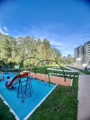 a playground with a slide in a park at Apartamento familiar y de descanso in Rionegro