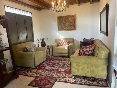 a living room with two chairs and a couch at Encanto Verde in Rionegro
