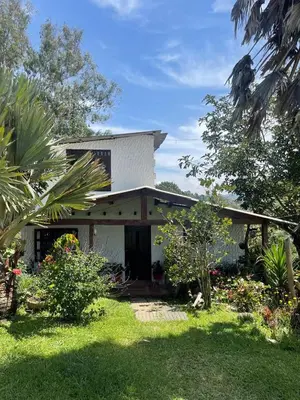 a house with a garden in front of it at Encanto Verde in Rionegro