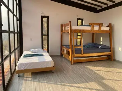 a bedroom with two bunk beds in a room at Finca cerca a Medellín Villa Cerat in Sopetran