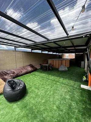 an outdoor room with a tent with green grass at Exclusivo apartamento con piscina y parqueadero 602 in Medellín