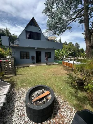 a fire pit in the yard of a house at Cabaña333 in Guatapé