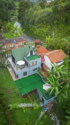 an overhead view of a house with a green roof at Cabaña333 in Guatapé