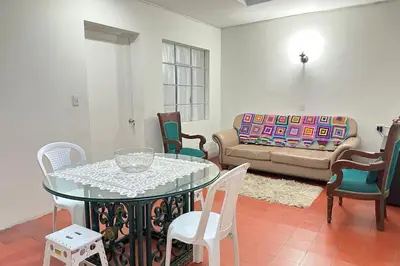 a living room with a table and chairs and a couch at HOSPEDAJE LAURa in Medellín
