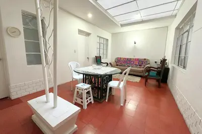 a room with a table and chairs and a couch at HOSPEDAJE LAURa in Medellín