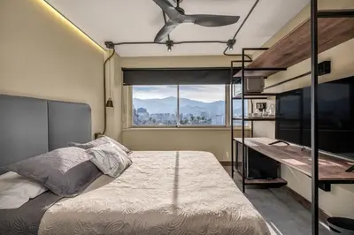 a bedroom with a bunk bed and a window at Nutibara Express By HOUSY in Medellín