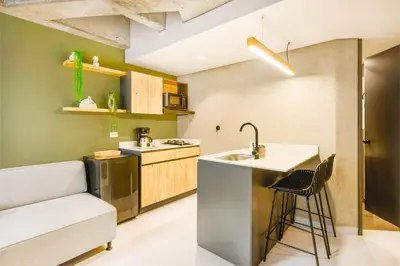 a kitchen with a sink and a counter at Firenze Lofts in Medellín