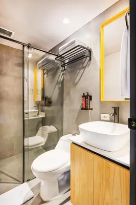 a bathroom with a toilet and a sink at Firenze Lofts in Medellín