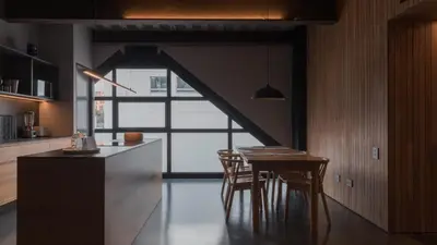 a kitchen with a table and chairs and a window at Zeta Erre Apartments in Medellín