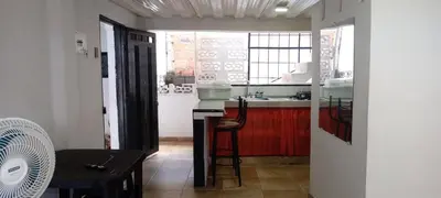 a kitchen with a counter and a sink in it at La Posada De Shaz En Norcasia in Norcasia