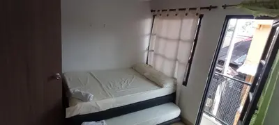 a small bed in a room with a window at La Posada De Shaz En Norcasia in Norcasia