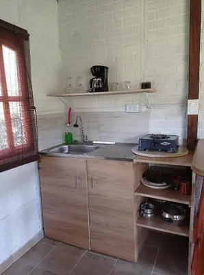 a kitchen with a sink and a counter top at Ancestral Cabaña in San Vicente