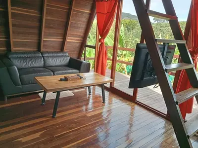 a living room with a couch and a coffee table at Cabaña en Jericó in Jericó