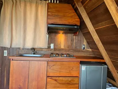 a kitchen with a sink and a stove at Cabaña en Jericó in Jericó