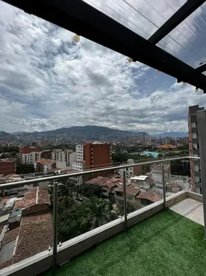 a view of a city from the balcony of a building at Apartamento en Laureles, con piscina y parquedero 401 in Medellín