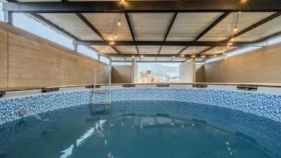 a large swimming pool in a building at Apartamento en laureles con piscina y parqueadero 402 in Medellín
