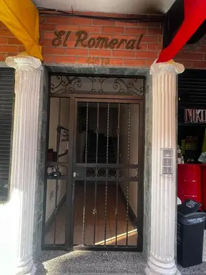 an entrance to a building with a wrought iron gate at Apartaloft in Sabaneta