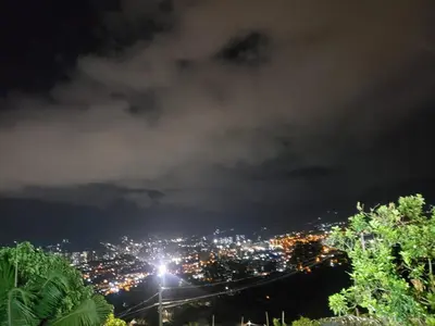 a view of a city at night at Pedacito de cielo in San Antonio de Prado