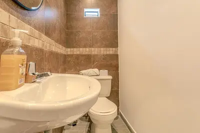 a bathroom with a sink and a toilet at Loft Recuerdos de mi tierra in Medellín