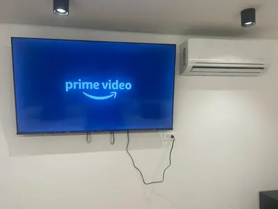a flat screen tv hanging on a wall at Loft Recuerdos de mi tierra in Medellín