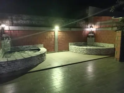 a room with two juzzles in a building at night at Casa de Veraneo in Mariquita