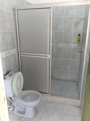 a bathroom with a shower with a toilet and a shower at Casa de Veraneo in Mariquita