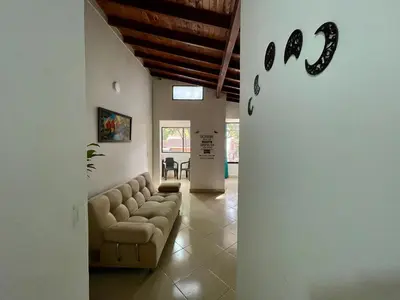 a living room with a couch and a table at explora la magia de laureles in Medellín