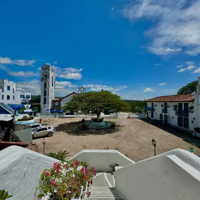 a large courtyard with a tree in the middle at Plaza Blanca in Doradal
