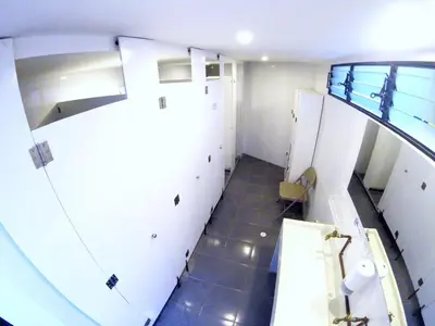 an overhead view of a bathroom with white cabinets at Hostal de la 57 in Manizales
