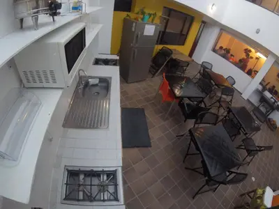 an overhead view of a living room with a tv and chairs at Hostal de la 57 in Manizales