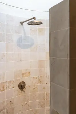 a shower with a valve in a bathroom at Arde La Selva in Santa Fe de Antioquia