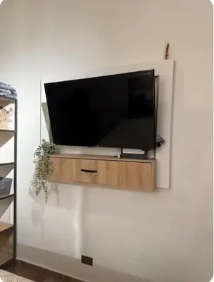 a flat screen tv sitting on a wall at Apartamento Envigado wifi 700 mb in Envigado
