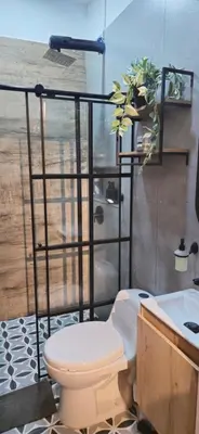 a bathroom with a toilet and a sink at Apartamento Envigado wifi 700 mb in Envigado
