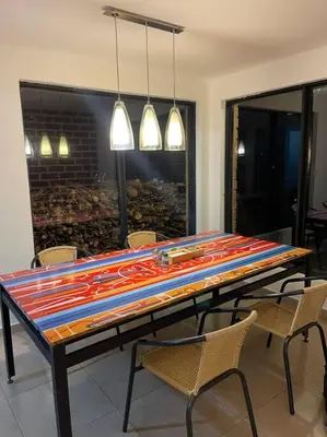 a dining room table with chairs and a large at Casa de Campo completa ubicada en Santa Elena in Santa Elena
